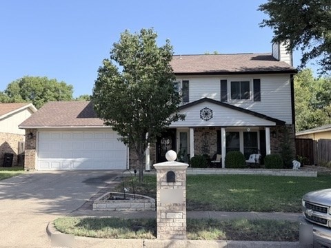 The same house photographed this week, with a mature tree in the front yard