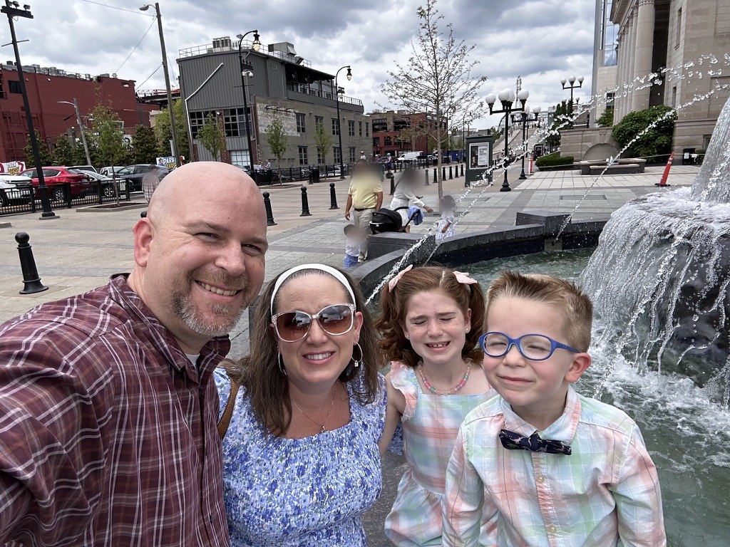 All four of us at the fountain, May 2024.
